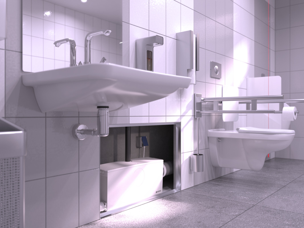 Zbliżenie na Małą przepompownię wewnętrzną zamontowaną w ścianie działowej, z podłączoną toaletą i umywalką.