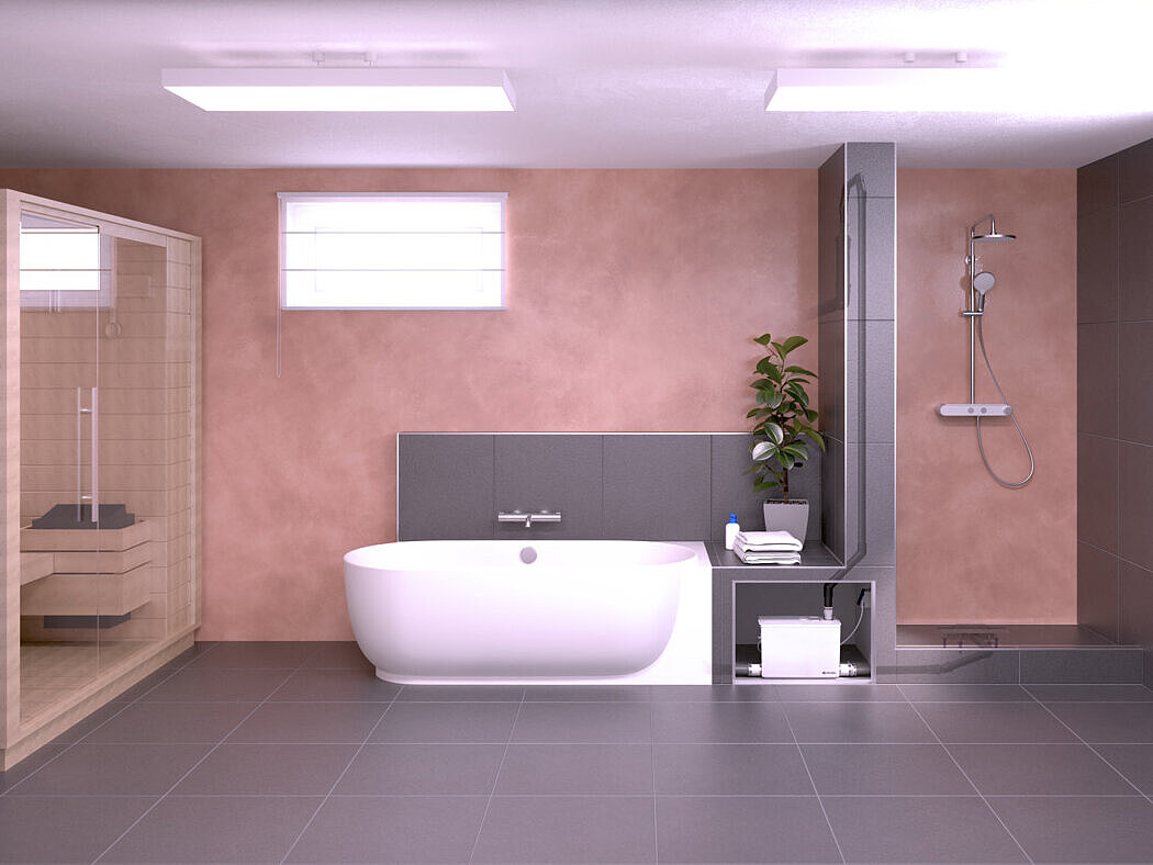 Pomieszczenie w piwnicy z sauną, wanną i prysznicem. Elementy kanalizacyjne są podłączone do Małej przepompowni wewnętrznej.